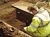 Benny Malonecarrying out archaeological dig